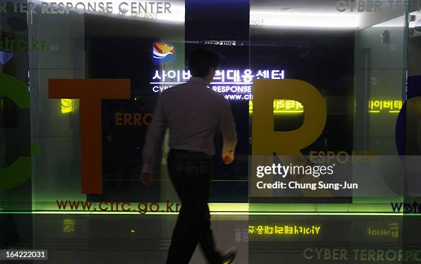 Man walks past at Cyber Terror Response Center at National Police Agency on March 21, 2013 in Seoul, South Korea. A cyber attack on the computer...