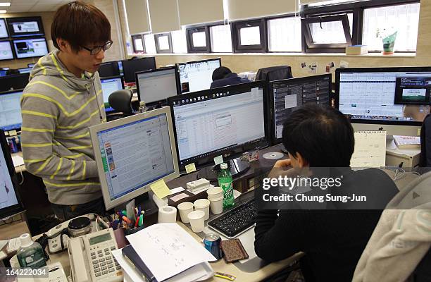 Researchers inspecting for computer viruses at Hauri Inc. The IT security software vendor on March 21, 2013 in Seoul, South Korea. A cyber attack on...