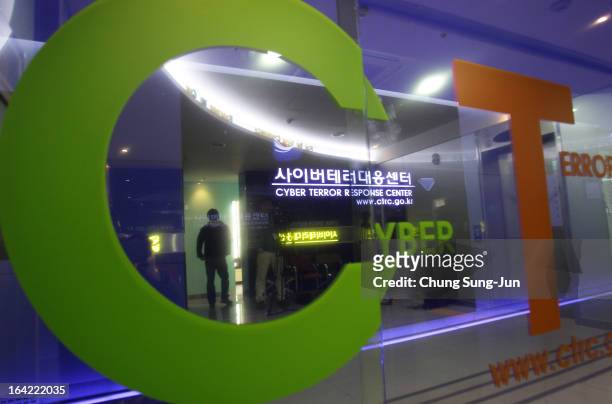 Man walks past at Cyber Terror Response Center at National Police Agency on March 21, 2013 in Seoul, South Korea. A cyber attack on the computer...