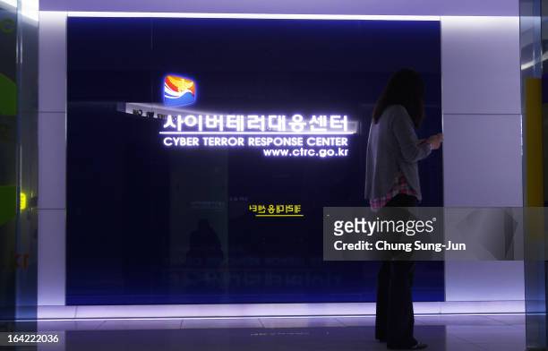 Woman walks past at Cyber Terror Response Center at National Police Agency on March 21, 2013 in Seoul, South Korea. A cyber attack on the computer...