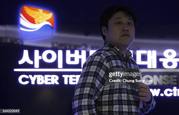 Man walks past at Cyber Terror Response Center at National Police Agency on March 21, 2013 in Seoul, South Korea. A cyber attack on the computer...