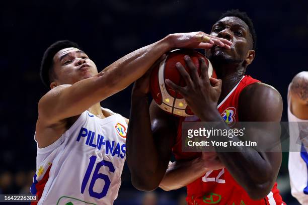Roger Pogoy of the Philippines competes for a rebound against Silvio De Sousa of Angola in the first quarter during the FIBA Basketball World Cup...