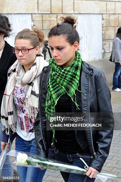 Students grieve on March 21, 2013 in front of l'Estuaire technical college in Blaye, south-western France, after the announcement that a fellow...