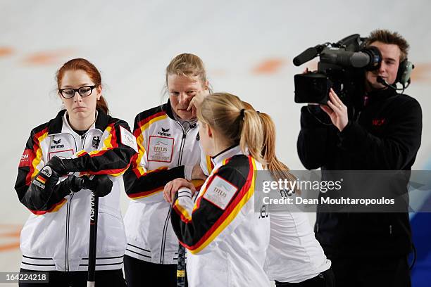 Andrea Schopp, Corinna Scholz, Stella Heiss and Imogen Oona Lehmann of Germany wait for a decision in the match between Switzerland and Germany as a...