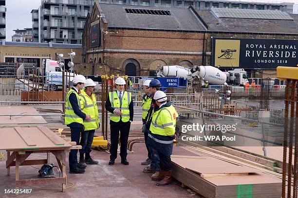 Chancellor George Osborne speaks to construction workers at the Berkeley Homes Royal Arsenal Riverside development in Woolwich on March 21, 2013 in...