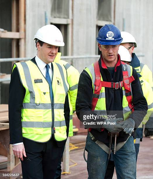 Chancellor George Osborne speaks to construction workers during a visit to the Berkeley Homes Royal Arsenal Riverside development in Woolwich, on...