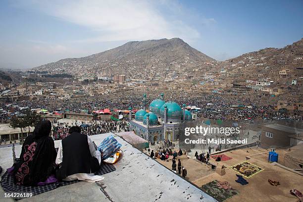 Afghan families gather near the Sakhi shrine, which is the centre of the Afghanistan new year celebrations during the Nowruz festivities on March 21,...