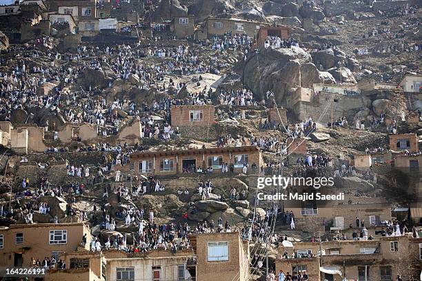 Afghan families gather on a hill top near the Sakhi shrine, which is the centre of the Afghanistan new year celebrations during the Nowruz...