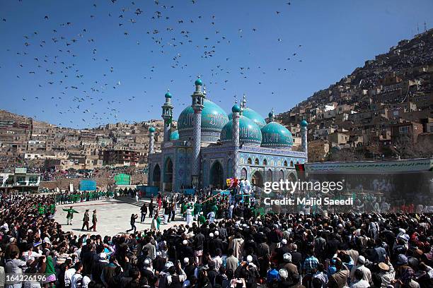 Afghan families gather near the Sakhi shrine, which is the centre of the Afghanistan new year celebrations during the Nowruz festivities on March 21,...