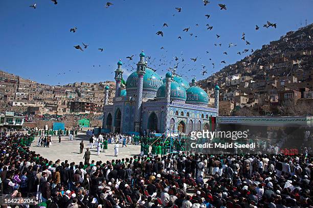 Afghan families gather near the Sakhi shrine, the centre of the Afghanistan new year celebrations in Kabul during Nowruz festivities on March 21,...