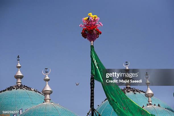 Afghan revellers raise the holy mace at the Sakhi shrine, which is the centre of the Afghanistan new year celebrations during the Nowruz festivities...