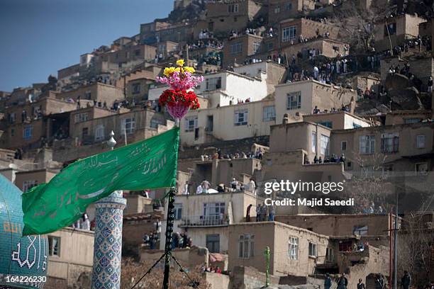 Afghan revellers raise the holy mace at the Sakhi shrine, which is the centre of the Afghanistan new year celebrations during the Nowruz festivities...