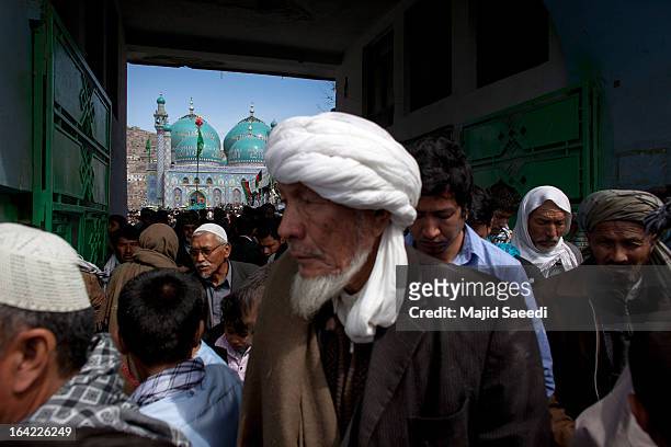 Afghan families gather near the Sakhi shrine, which is the centre of the Afghanistan new year celebrations during the Nowruz festivities on March 21,...