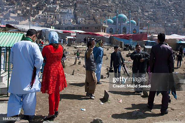 Afghan families gather near the Sakhi shrine, which is the centre of the Afghanistan new year celebrations during the Nowruz festivities on March 21,...