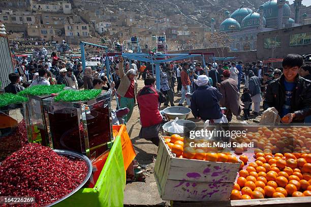 Afghan families gather near the Sakhi shrine, which is the centre of the Afghanistan new year celebrations during the Nowruz festivities on March 21,...