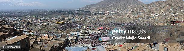 Afghan families gather near the Sakhi shrine, which is the centre of the Afghanistan new year celebrations during the Nowruz festivities on March 21,...