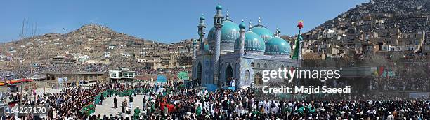 Afghan families gather near the Sakhi shrine, which is the centre of the Afghanistan new year celebrations during the Nowruz festivities on March 21,...