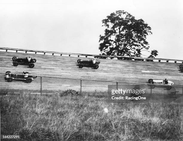 Fred Frame leads a trio of competitors during a race on the half mile Woodbridge Speedway board track. The facility operated with a board surface...