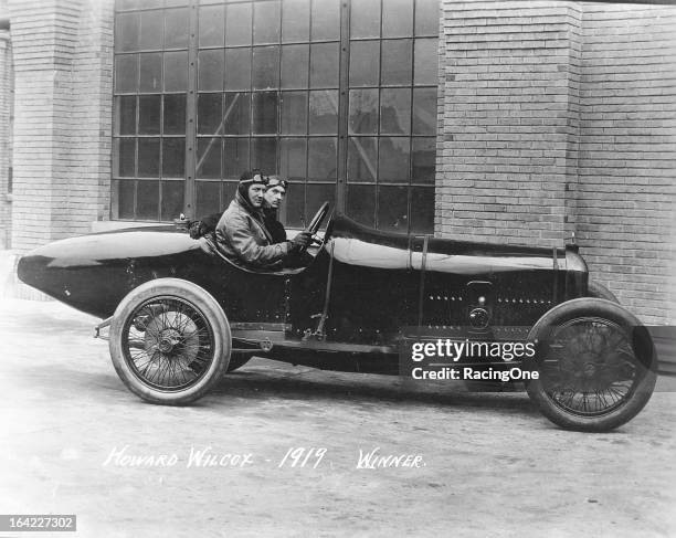 Indiana native Howard “Howdy” Wilcox and his riding mechanic Leo Banks with the Peugeot that Wilcox drove to victory in the Indianapolis 500 AAA Indy...