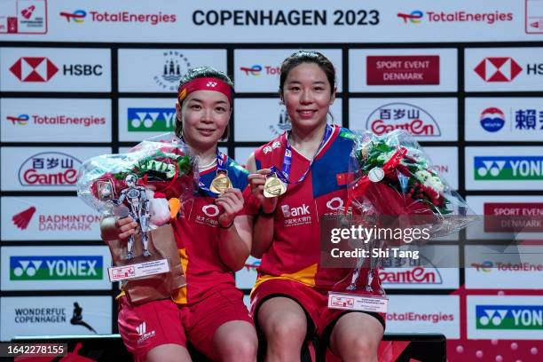 Chen Qingchen and Jia Yifan of China pose with their medals on the podium after the Women's Doubles Final match against Apriyani Rahayu and Siti...