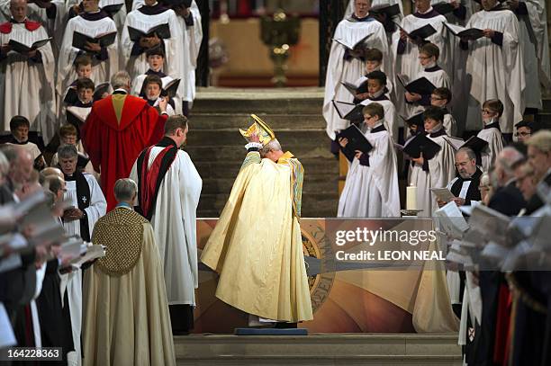 The Archbishop of Canterbury takes off his mitre during his enthronement at Canterbury Cathedral in Canterbury on March 21, 2013. Former oil...
