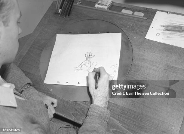 Disney animator works on a sketch of Donald Duck circa 1936 in Los Angeles, California.