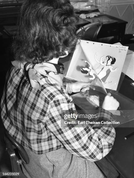 Disney animator works on cells from the film 'Snow White' circa 1936 in Los Angeles, California.