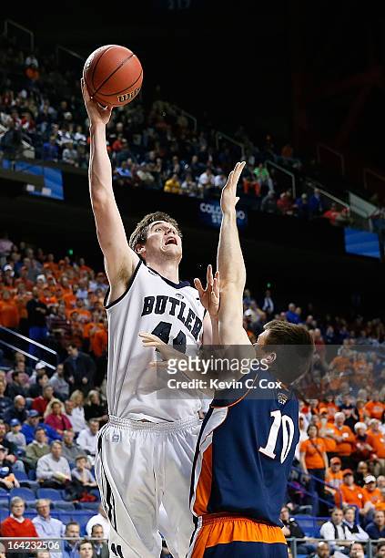 Andrew Smith of the Butler Bulldogs shoots against Brian Fitzpatrick of the Bucknell Bison in the second half during the second round of the 2013...