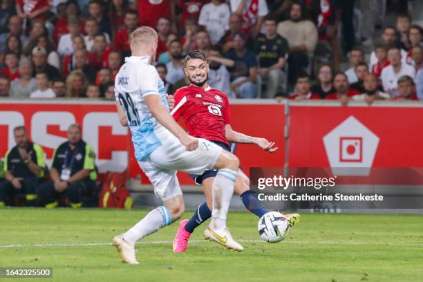Remy Cabella of Lille OSC shoots the ball against Ivan Smolcic of HNK Rijeka during the Europa Conference League play-off match between Lille and HNK...