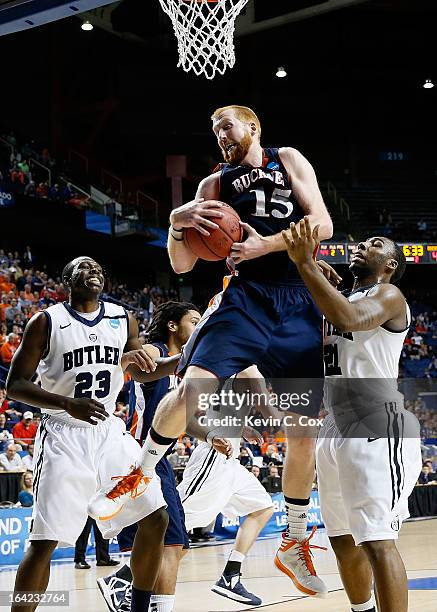 Joe Willman of the Bucknell Bison rebounds against Khyle Marshall and Roosevelt Jones of the Butler Bulldogs in the second half during the second...