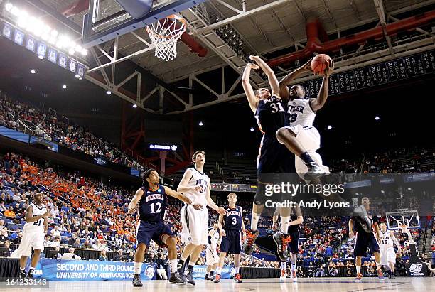 Khyle Marshall of the Butler Bulldogs shoots against Mike Muscala of the Bucknell Bison in the second half during the second round of the 2013 NCAA...