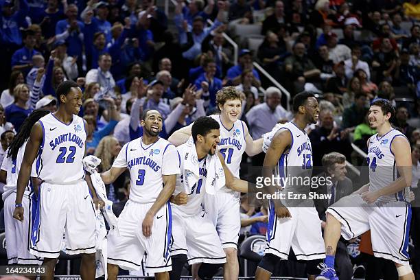 The Saint Louis Billikens bench celebrates in the final moments of their 64 to 44 win over the New Mexico State Aggies during the second round of the...