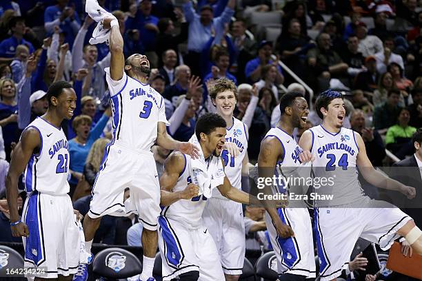 The Saint Louis Billikens bench celebrates in the final moments of their 64 to 44 win over the New Mexico State Aggies during the second round of the...