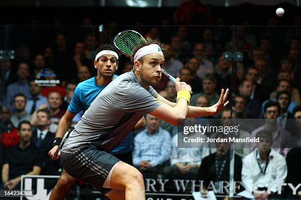 James Willstrop of England in action against Mohamed El Shorbagy of Egypt during their semi-final match in the Canary Wharf Squash Classic on March...