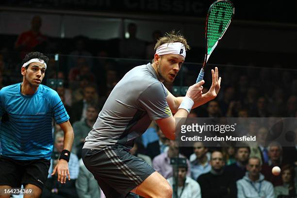 James Willstrop of England in action against Mohamed El Shorbagy of Egypt during their semi-final match in the Canary Wharf Squash Classic on March...
