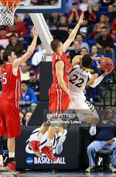 Chris Czerapowicz of the Davidson Wildcats defends the net against Trent Lockett of the Marquette Golden Eagles in the first half during the second...