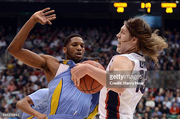 Kelly Olynyk of the Gonzaga Bulldogs with the ball against Brandon Moore of the Southern University Jaguars in the first half during the second round...