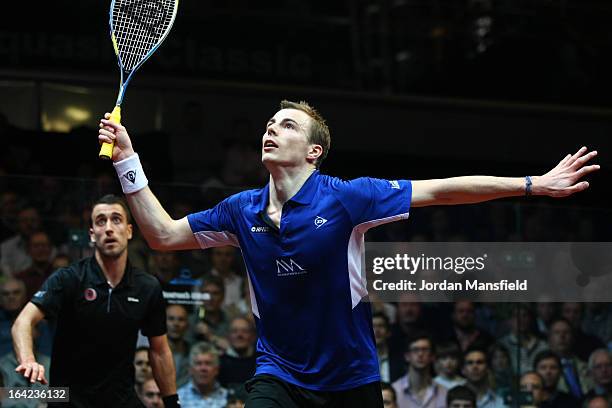 Nick Matthew of England in action against Peter Barker of England in their semi-final match in the Canary Wharf Squash Classic on March 21, 2013 in...