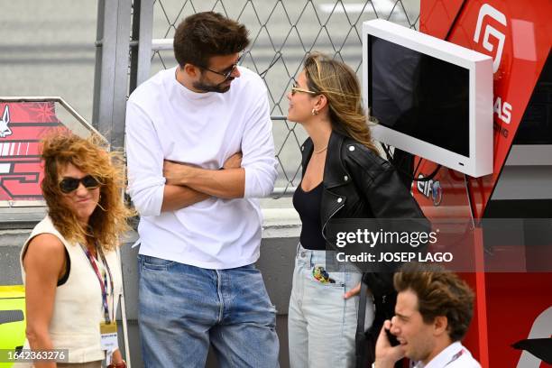 Former Barcelona's Spanish defender Gerard Pique and his partner Clara Chia Marti attend the Moto2 race of the Moto Grand Prix de Catalunya at the...