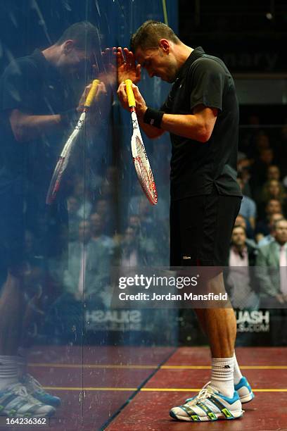 Peter Barker of England leans against the wall after losing a point in his semi-final match against Nick Matthew of England in the Canary Wharf...