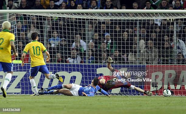 Oscar of Brazil scores the second goal during the international friendly match between Italy and Brazil on March 21, 2013 in Geneva, Switzerland.
