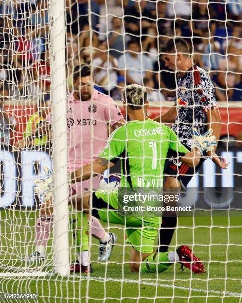 Lionel Messi of Inter Miami is stopped by Carlos Miguel Coronel of New York Red Bulls during their match at Red Bull Arena on August 26, 2023 in...
