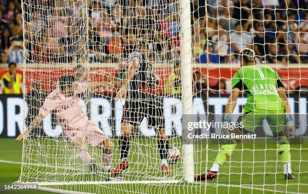 Lionel Messi of Inter Miami is stopped by Carlos Miguel Coronel of New York Red Bulls during their match at Red Bull Arena on August 26, 2023 in...