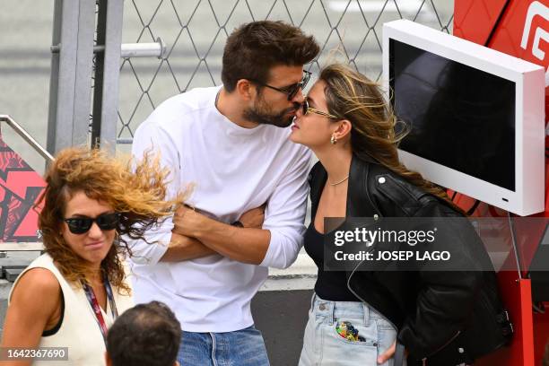 Former Barcelona's Spanish defender Gerard Pique and his partner Clara Chia Marti attend the Moto2 race of the Moto Grand Prix de Catalunya at the...