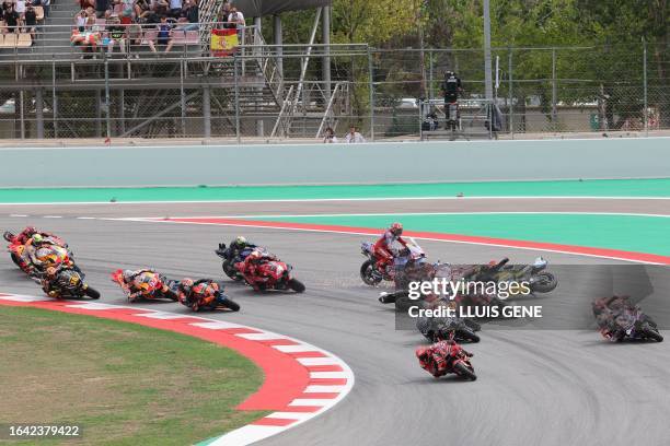 Riders fall during the MotoGP race of the Moto Grand Prix de Catalunya at the Circuit de Catalunya in Montmelo, on the outskirts of Barcelona, on...