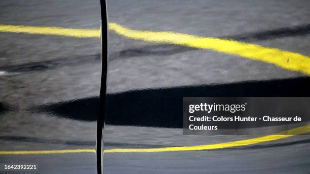 a yellow line is reflected and distorted on the body of a gray car - car crash wall stock pictures, royalty-free photos & images