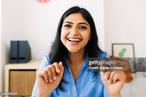 pov or portrait screen view of young pretty indian businesswoman talking on laptop computer video call at home. business people and virtual conference concept. - webcam stock pictures, royalty-free photos & images