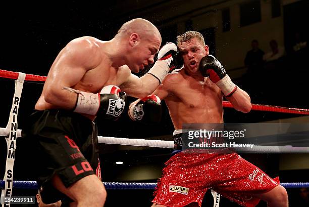 Billy Joe Saunders and Matthew Hall in action during their British and Commonwealth Middleweight Title Fight at York Hall on March 21, 2013 in...