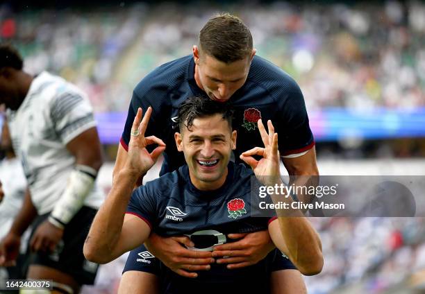 Jonny May of England celebrates after scoring the team's first try during the Summer International match between England and Fiji at Twickenham...