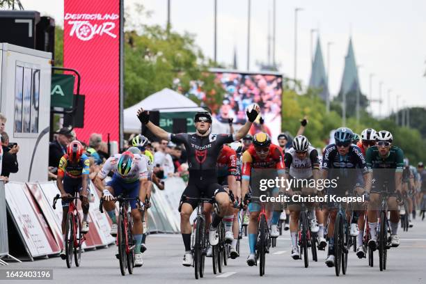 Arvid De Kleijn of The Netherlands and Tudor Pro Cycling Team celebrates at finish line as stage winner ahead of Phil Bauhaus of Germany and Team...